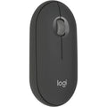 Prime Tech Store Logitech Pebble Mouse 2 M350S Bluetooth wireless mouse on a desk, compact design with scroll wheel and smooth surface.