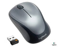 Wireless Logitech M235 mouse with ergonomic design and scroll wheel, shown on a desk surface.
