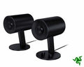 Razer Nommo 2.0 PC speakers with sleek black design and compact size, featuring dual speaker units on a flat surface.