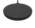 Wireless charging pad by Belkin with 10W power output, shown without included adapter, sleek black design on a smooth surface.