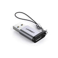 UGREEN USB 3.0 male to Type C female adapter connected to a device, showing compact design and blue USB port.