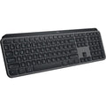 Logitech MX Keys S wireless illuminated keyboard in graphite color with backlit keys on a sleek workspace.