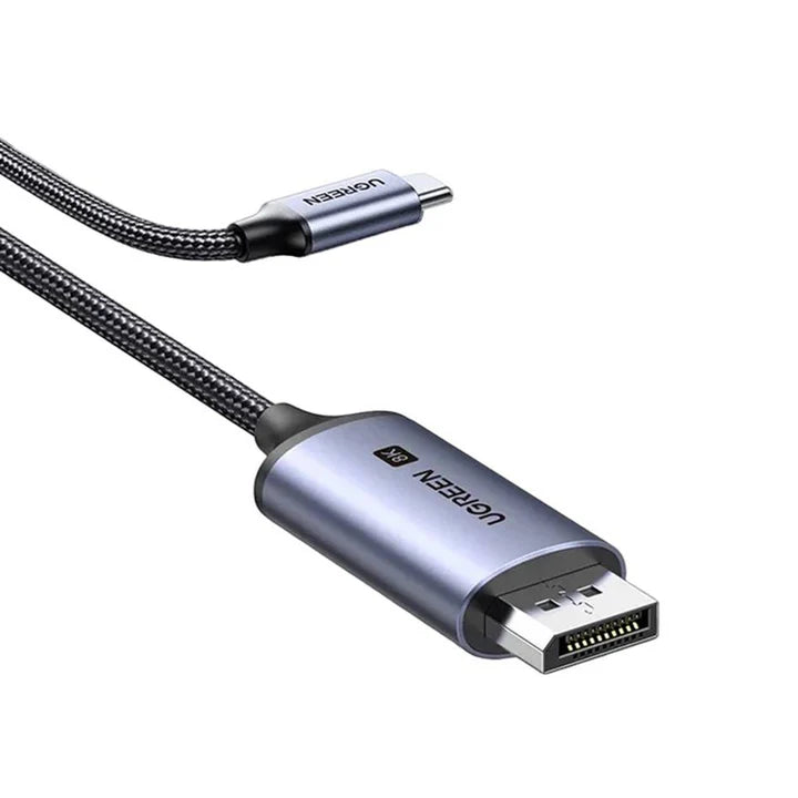 UGREEN CM556 Type C to DisplayPort 8K cable connected to a laptop, showcasing high-resolution video transmission with sleek design.