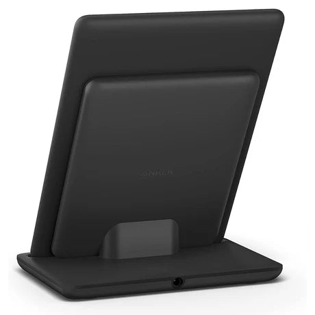Anker wireless charging dock for Kindle Signature Editions, showing a sleek black charging station with Kindle device placed on it.