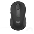 Wireless Logitech M650 mouse from Prime Tech Store, shown in black with ergonomic design and scroll wheel on a desk surface.